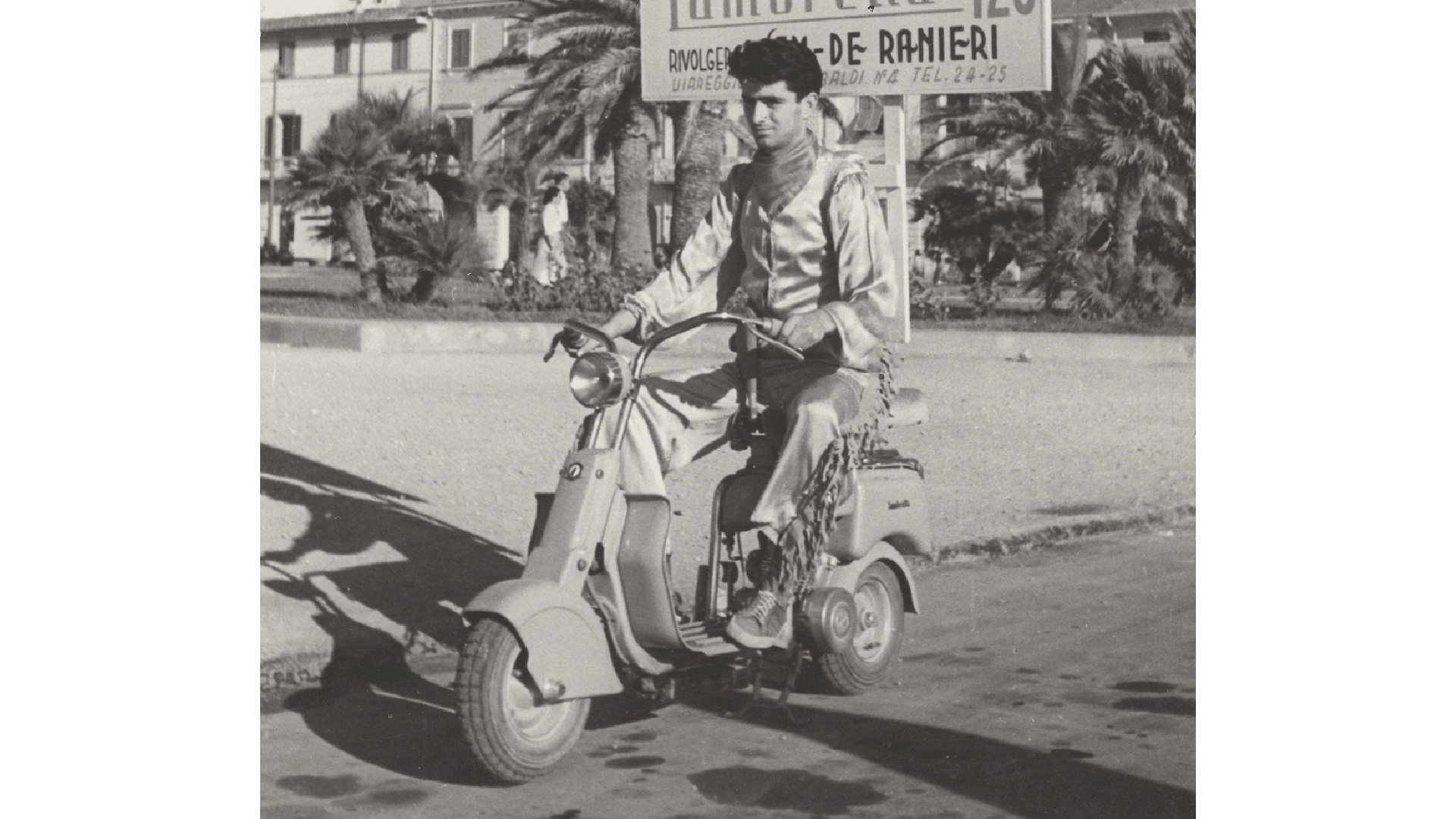 A person driving the Lambretta scooter